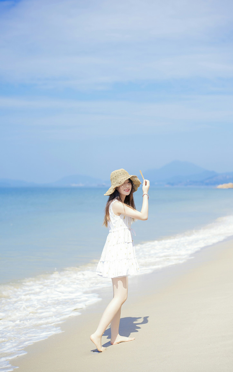 夏日海边草帽美女手机壁纸