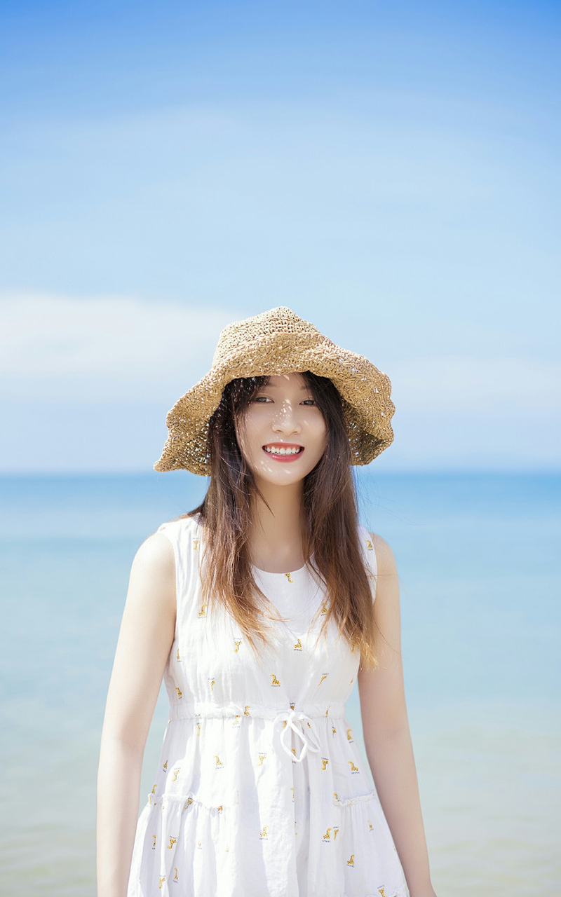 夏日海边草帽美女手机壁纸